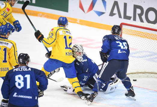 Sweden´s Joel Kellman sees the the puck go in behind