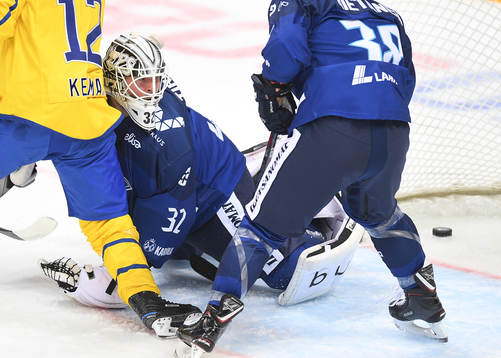 Finland's goalie Rasmus Tirronen misses a goal