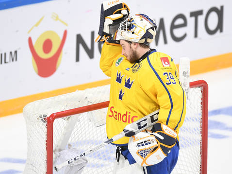 Sweden's goalie Adam Reideborn reacts