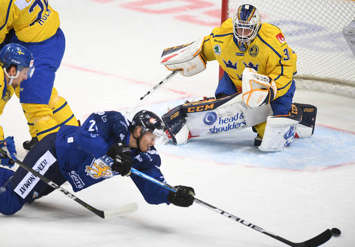 Sweden's goalie Adam Reideborn watches as Finland's Jani