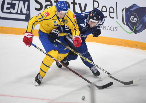 Sweden's Anton Wedin, left, and Finland's Jukka Peltola