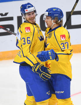 Sweden's Emil Larsson, left, celebrates his goal with John