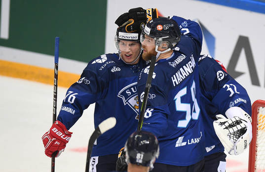 Finland's players celebrate the team's 3-2 victory at the
