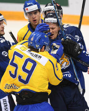 Sweden's Linus Johansson, left, and Finland's Jani Lajunen