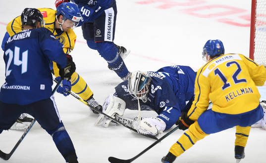 Finland's goalie Rasmus Tirronen makes a save