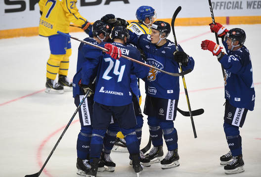 Finland's players celebrate his team's third goal