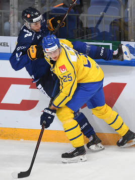 Sweden's Philip Holm, right, boards Finland's Eetu