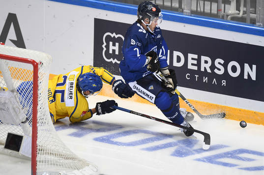 Sweden's Philip Holm, left, falls