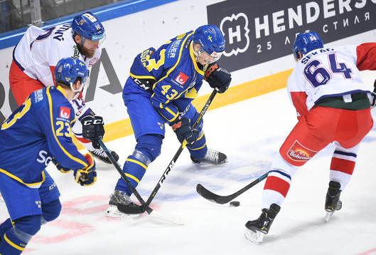 Sweden's Tom Nilsson controls a puck