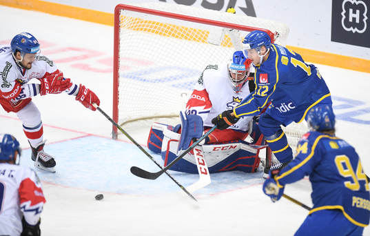 Sweden's Joel Kellman, top right, tries to score past Czech