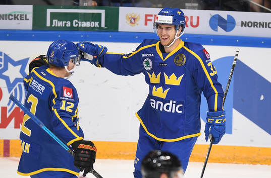 Sweden's Michael Lindqvist, right, celebrates his goal with