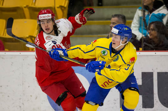 Denmark forward Emil Marcussen (24)  battles with Sweden