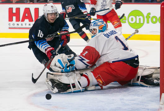 Jay O’Brien #16 of the United States is stopped by goalie