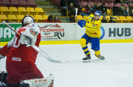 Sweden forward Jacob Olofsson (18)  scores in  overtime