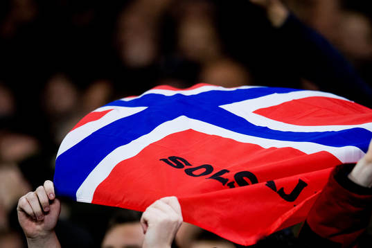 Supporters of Manchester United with a Norwegian flag