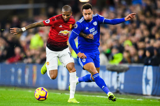 Ashley Young of Manchester United and Josh Murphy of Cardiff