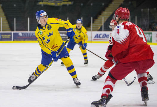 Sweden defenceman Adam Boqvist (3) shoots against Denmark