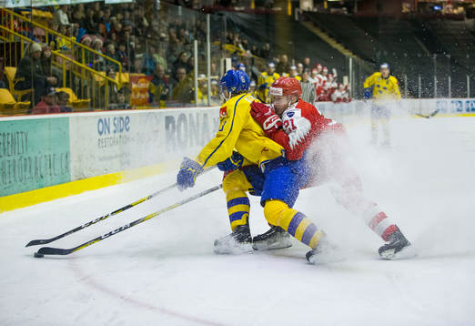 Denmark forward Gustav Green (21)  checks Sweden forward