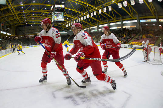 Denmark defenceman Oscar Schulze (25)  and forward Jonas