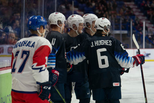 Oliver Wahlstrom #18 of the United States (middle) is