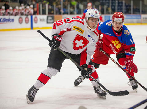 Switzerland forward Ramon Tanner (20) battles with Russia
