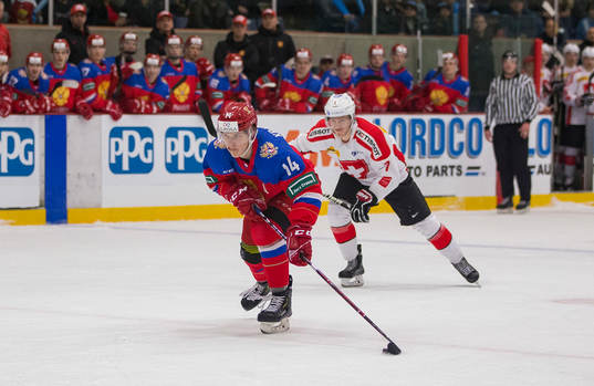 Russia forward Vitalii Kravtsov (14) breaks in