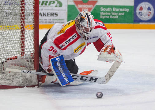 Switzerland goalie Akira Schmid (29)  makes a save against