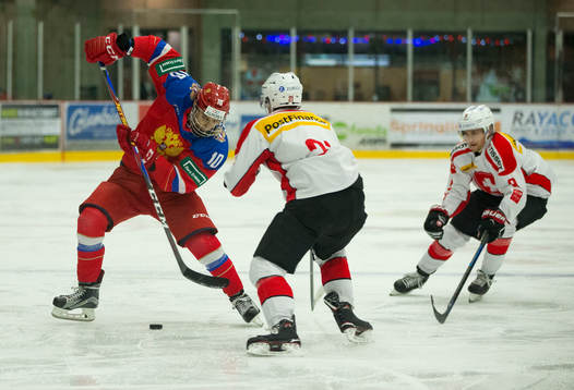 Switzerland defenceman Tim Berni (21)  checks Russia