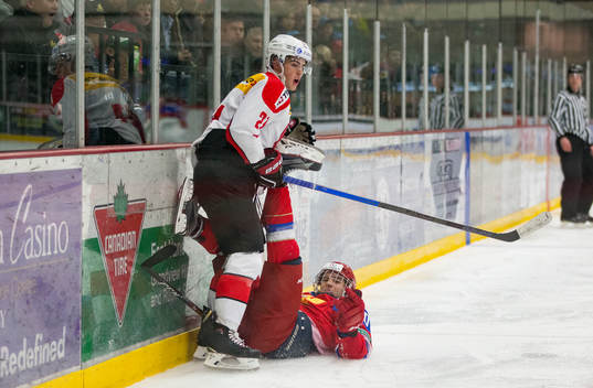 Switzerland defenceman Tim Berni (21)  checks Russia