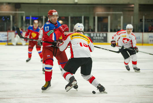 Switzerland defenceman Davyd Barandun (19)  checks Russia
