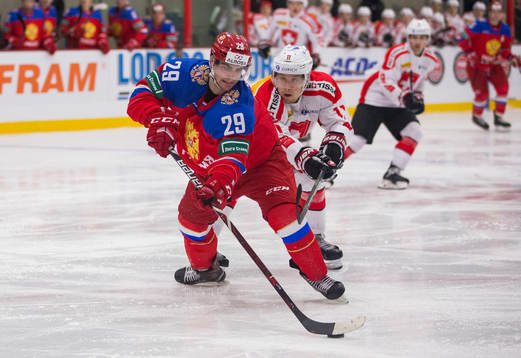 Switzerland forward Sven Leuenberger (11)  checks Russia