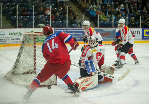 Switzerland goalie Akira Schmid (29) makes a save
