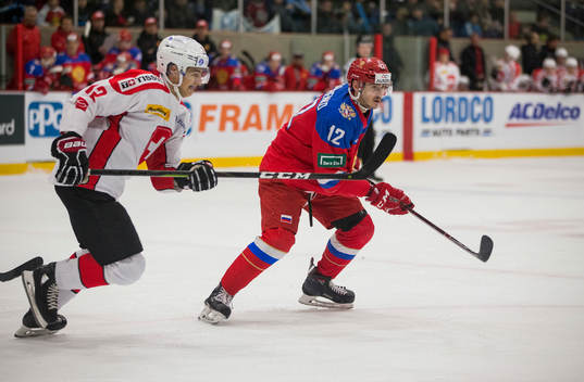 Switzerland forward Jeremi Gerber (12)  battles with Russia