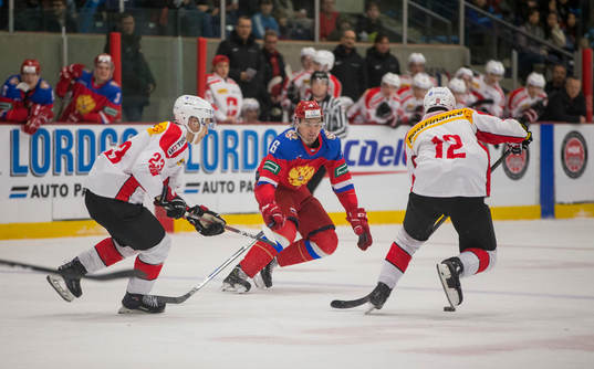 Russia defenceman Ilia Morozov (6) checks Switzerland