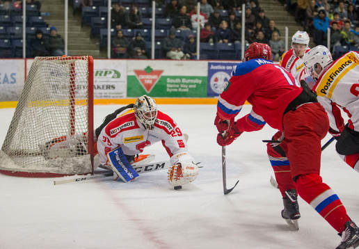 Switzerland goalie Akira Schmid (29)  makes a save