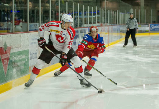 Russia defenceman Mark Rubinchik (27) checks Switzerland