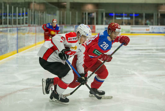 Russia forward Grigory Denisenko (28)  checks Switzerland