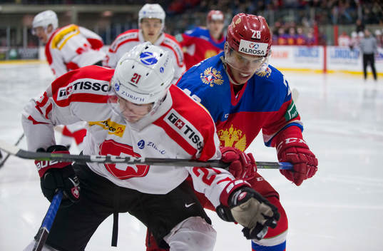 Russia forward Grigory Denisenko (28)  checks Switzerland