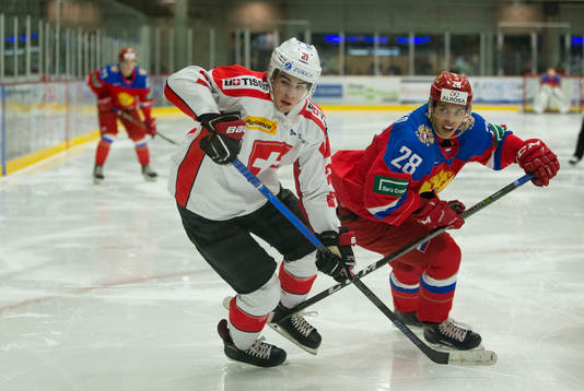 Russia forward Grigory Denisenko (28)  checks Switzerland