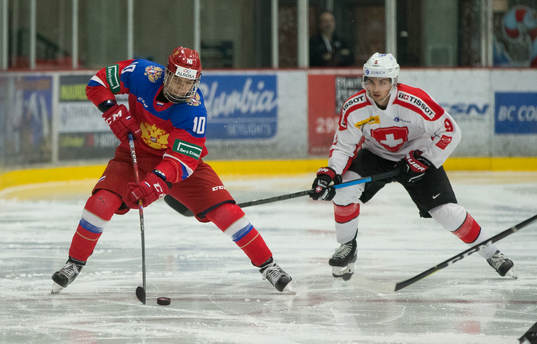Switzerland forward Nicolas Müller (9) checks Russia