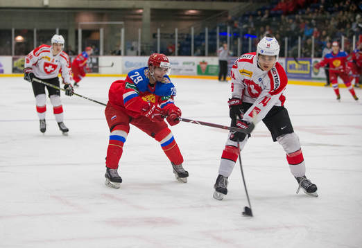 Russia forward Kirill Slepetc (29)  checks Switzerland