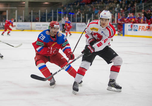 Russia forward Kirill Slepetc (29)  checks Switzerland
