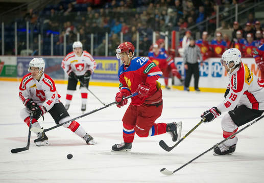 Switzerland defenceman Davyd Barandun (19) checks Russia