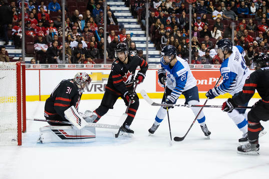 Anton Lundell of Finland scores 3-1 behind goalkeeper Ian