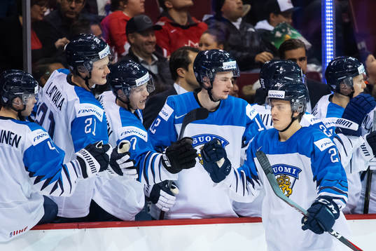 Eeli Tolvanen of Finland celebrates with teammates