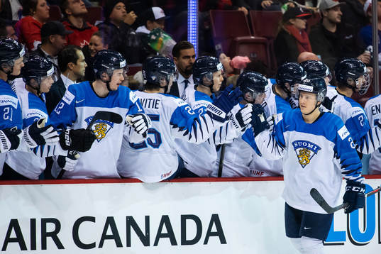 Eeli Tolvanen of Finland celebrates with teammates