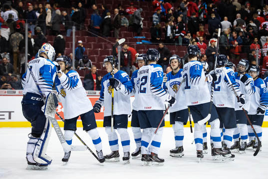 Players of team Finland celebrate their win