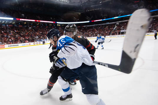 Henri Jokiharju of Finland and Cody Glass of Canada