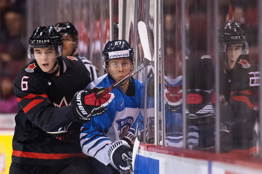 Noah Dobson of Canada and Jesse Ylönen of Finland