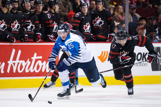 Aarne Talvitie of Finland and Nicholas Suzuki of Canada